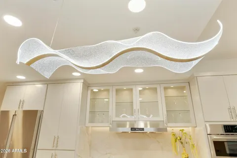 a bathroom with a sink mirror and bathtub