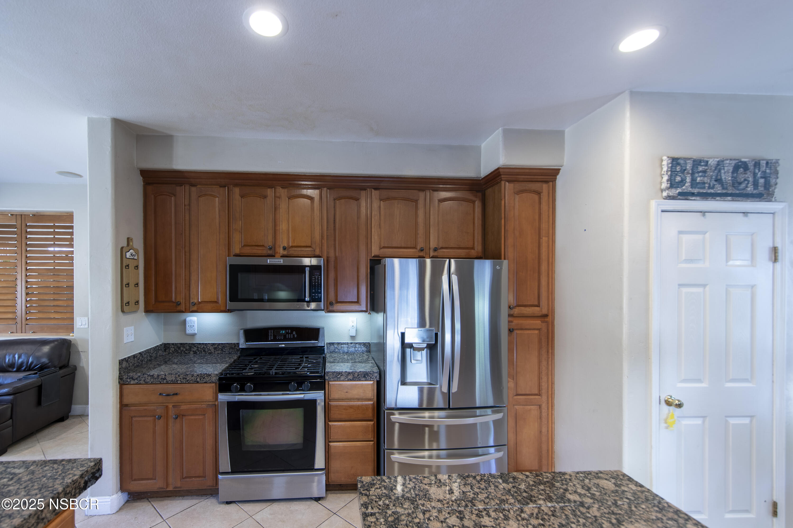 2324 Carrizo Lompoc, CA 93436 - Photo 11 of 62 a kitchen with granite countertop a refrigerator stove and microwave