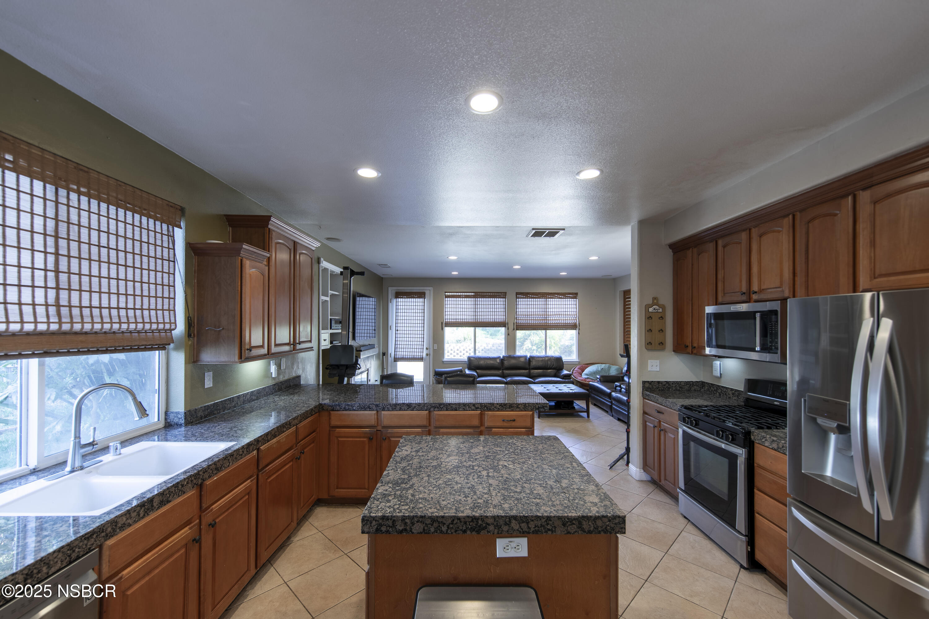 2324 Carrizo Lompoc, CA 93436 - Photo 13 of 62 a kitchen with stainless steel appliances granite countertop a stove sink refrigerator and cabinets