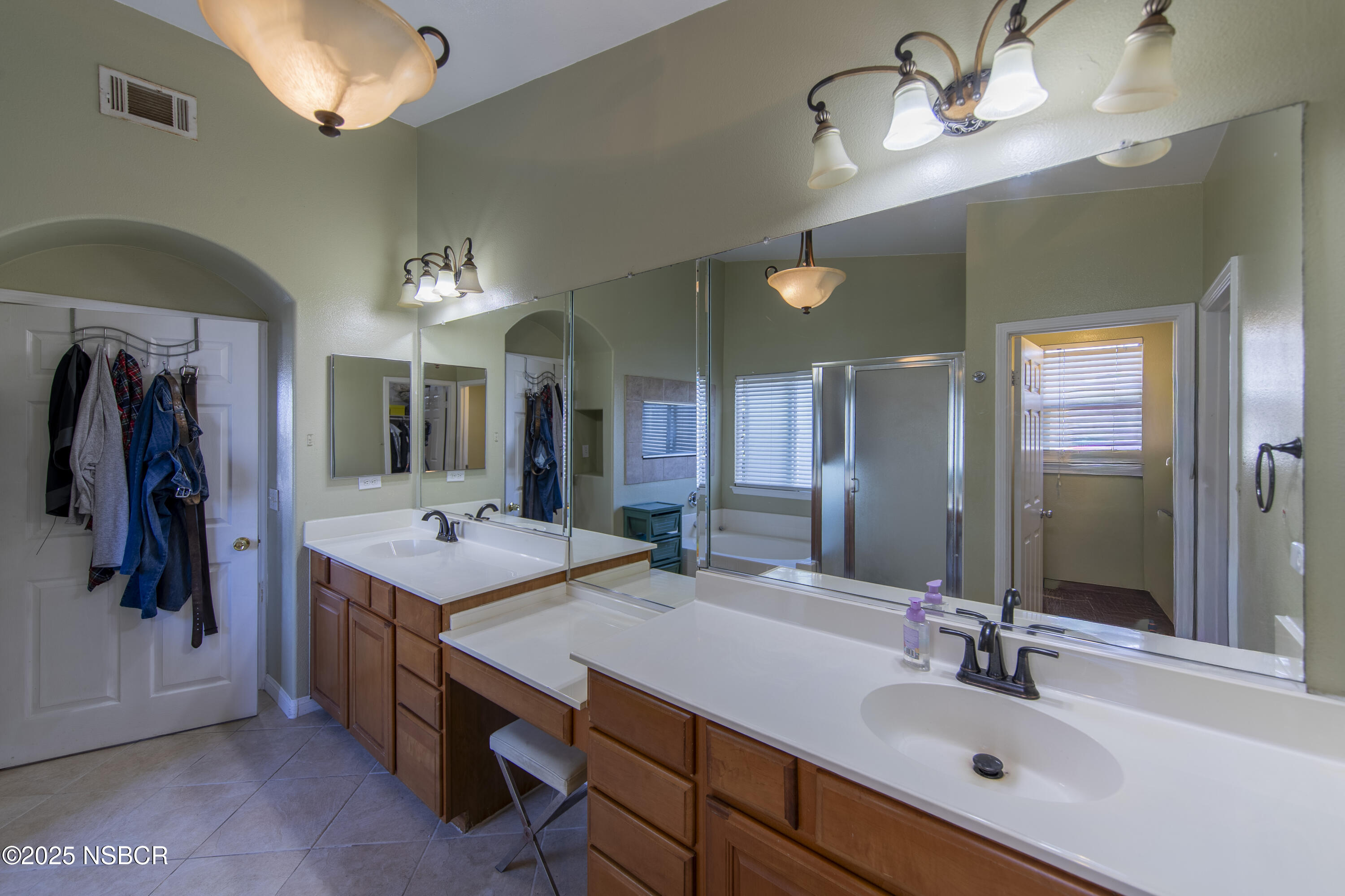2324 Carrizo Lompoc, CA 93436 - Photo 30 of 62 a bathroom with a double vanity sink and a mirror