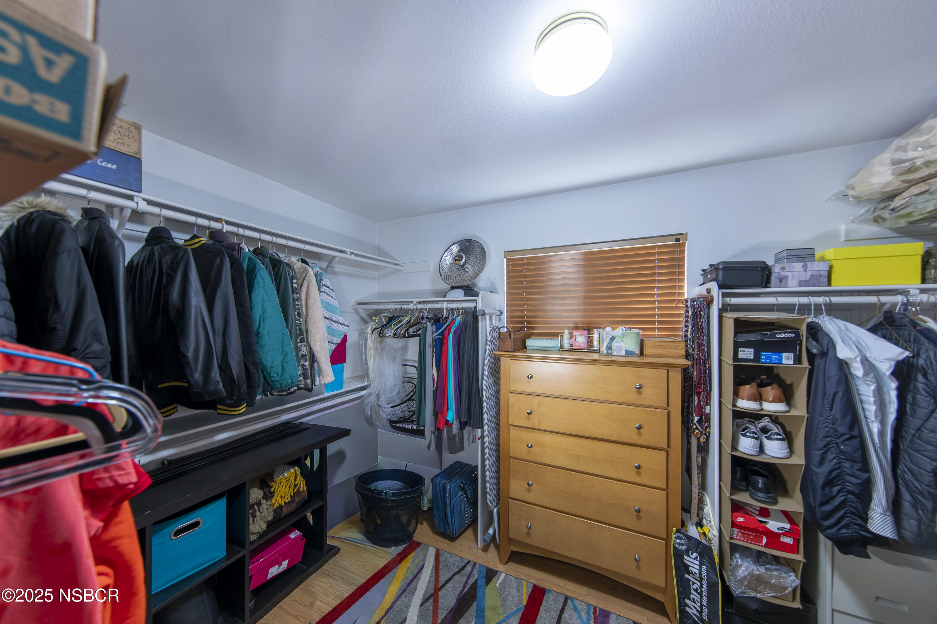 2324 Carrizo Lompoc, CA 93436 - Photo 32 of 62 a view of walk in closet with clothes and shoes