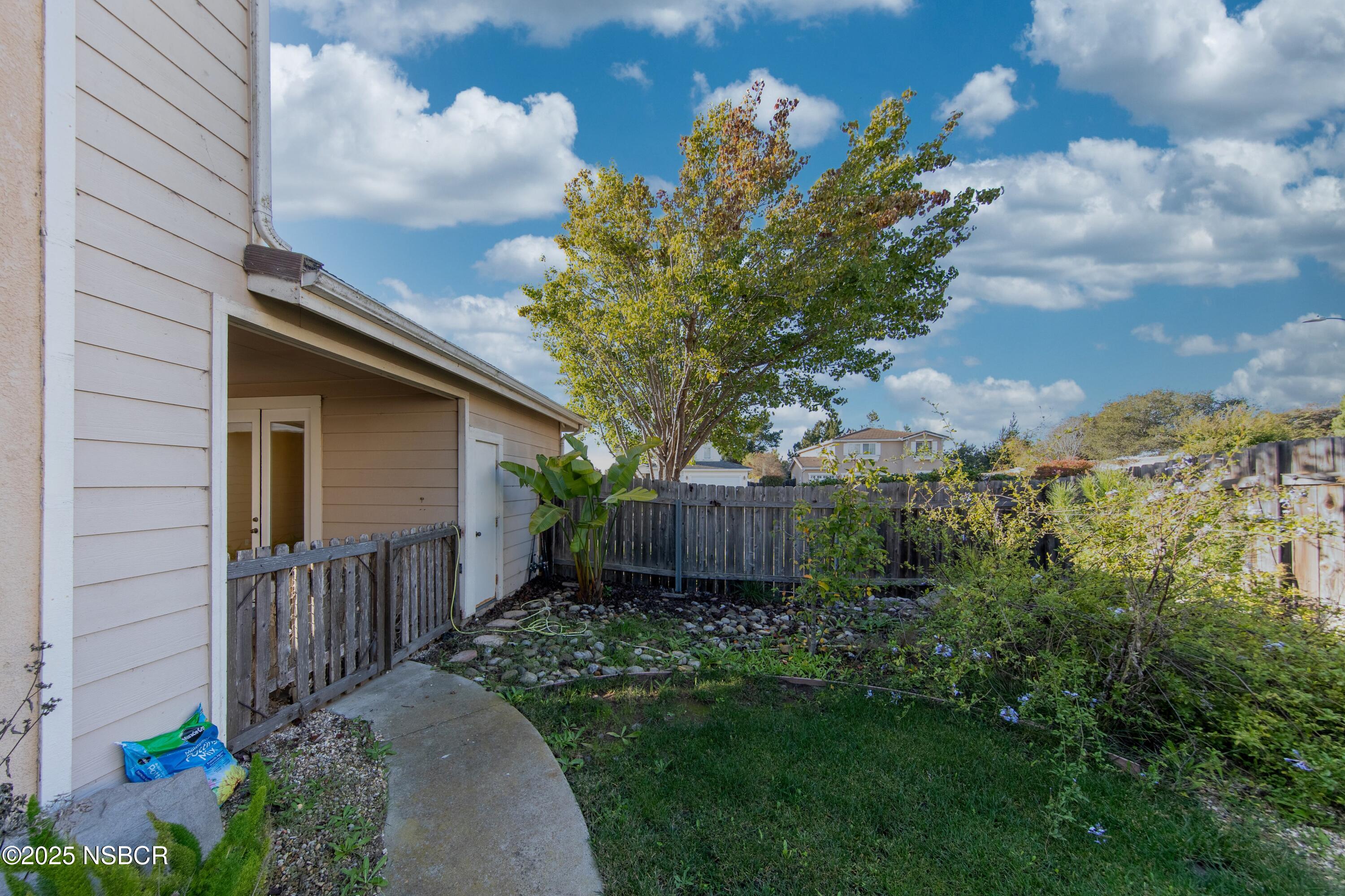 2324 Carrizo Lompoc, CA 93436 - Photo 52 of 62 a view of a backyard with potted plants and large tree