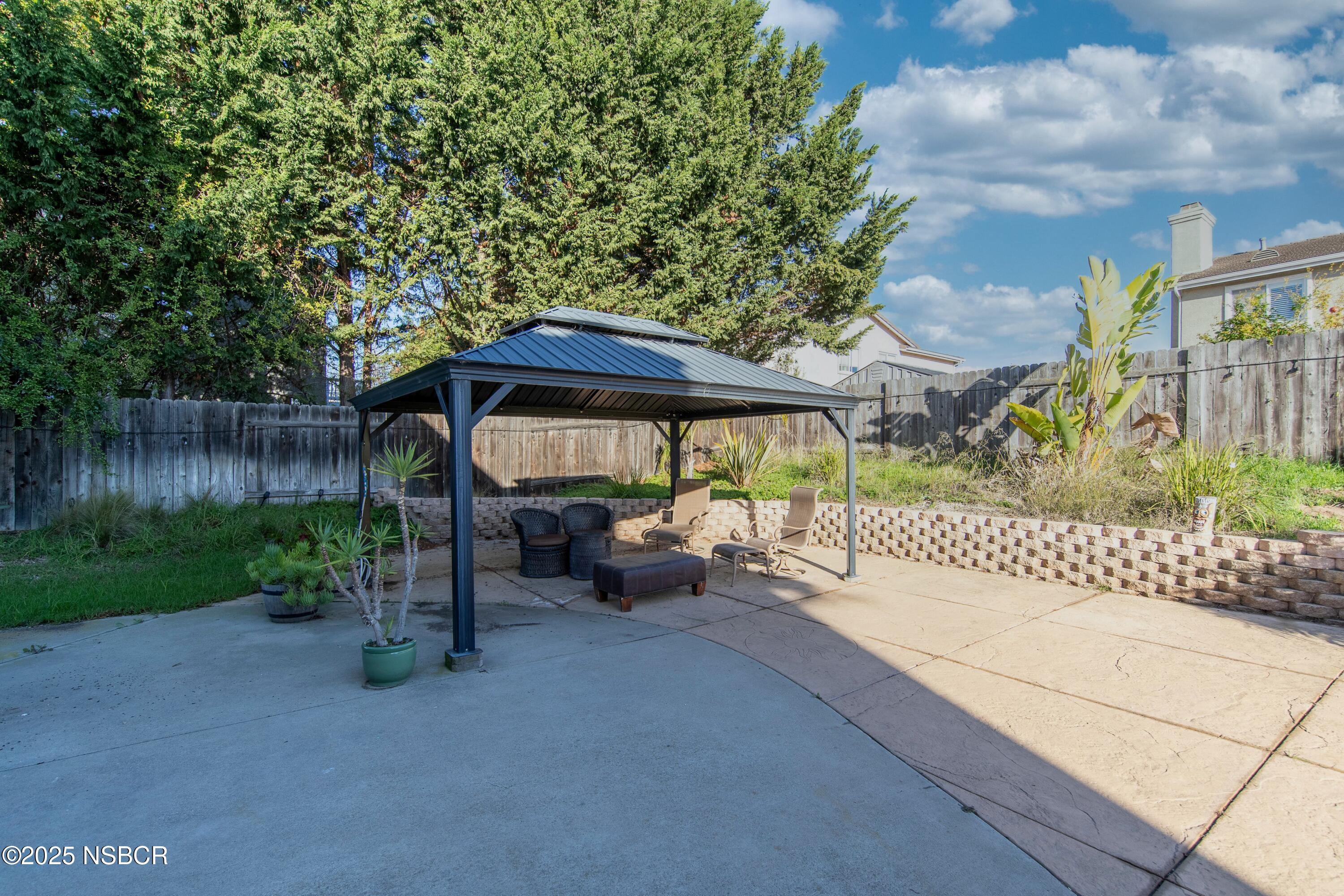 2324 Carrizo Lompoc, CA 93436 - Photo 54 of 62 a backyard of a house with table and chairs