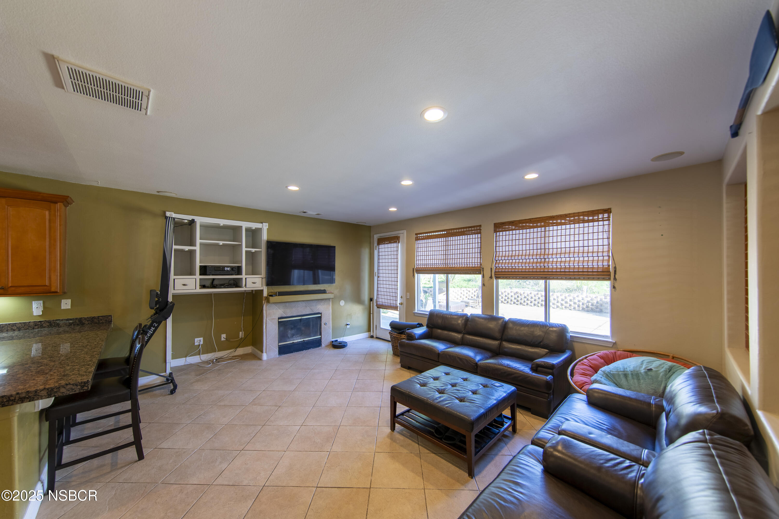 2324 Carrizo Lompoc, CA 93436 - Photo 7 of 62 a living room with furniture a flat screen tv and a fireplace