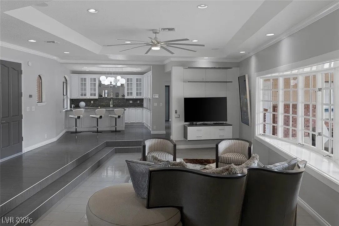 9 Quail Run Road Henderson, NV 89014 - Photo 12 of 57 An open concept living area connects seamlessly with the modern kitchen, creating an ideal space for entertaining.