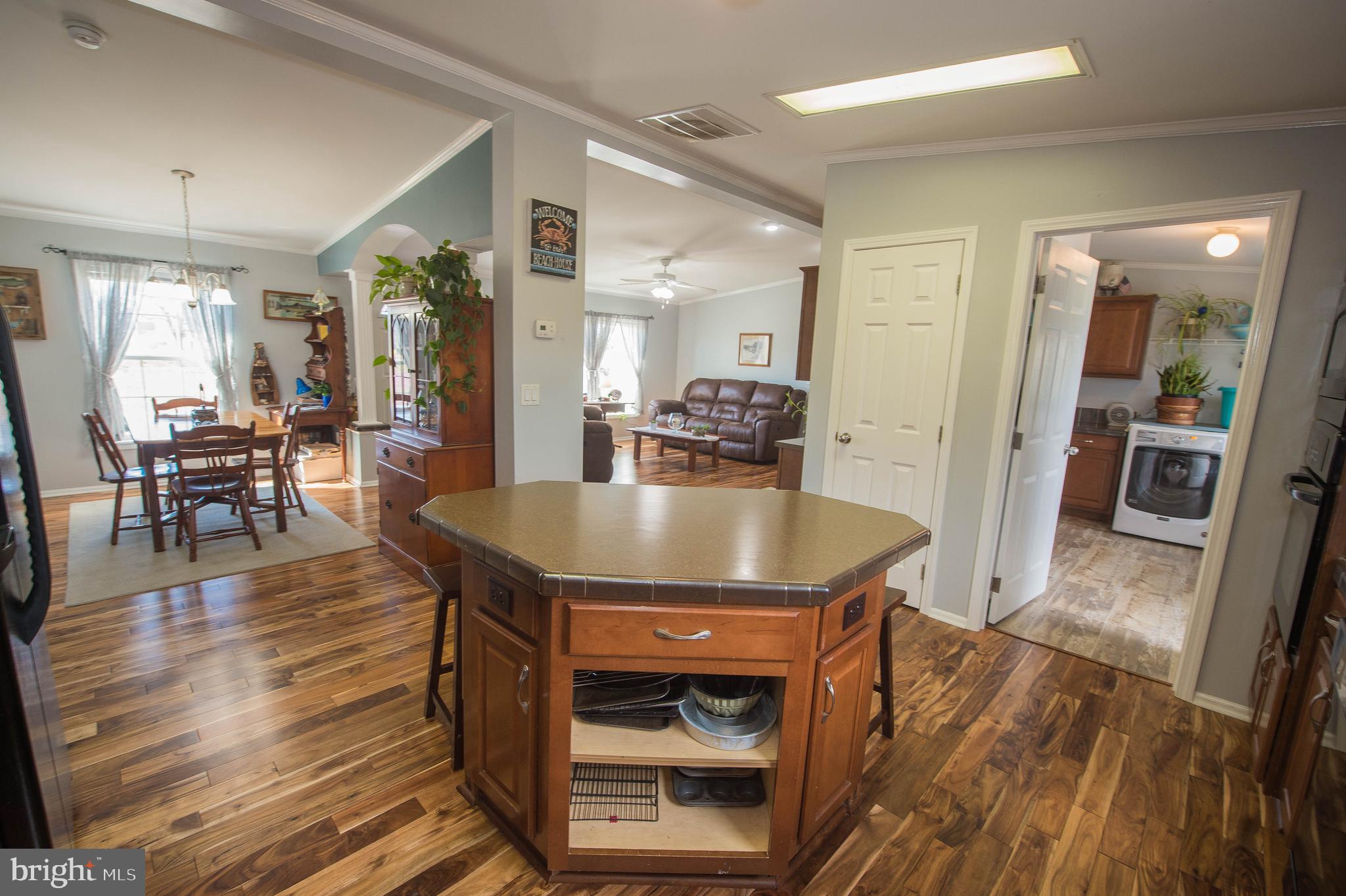 36388 Poplar Neck Road Willards, MD 21874 - Photo 27 of 34 a view of a dining room with furniture and wooden floor