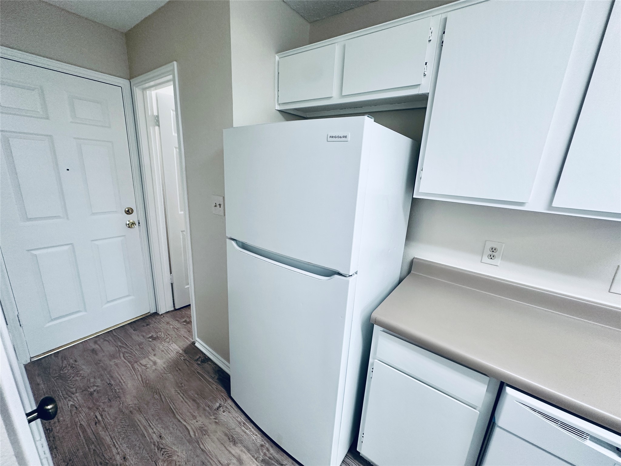 379 Fantail Loop, Unit B Austin, TX 78734 - Photo 14 of 33 Functional kitchen design maximizes space with plentiful cabinetry and durable wood-look flooring.