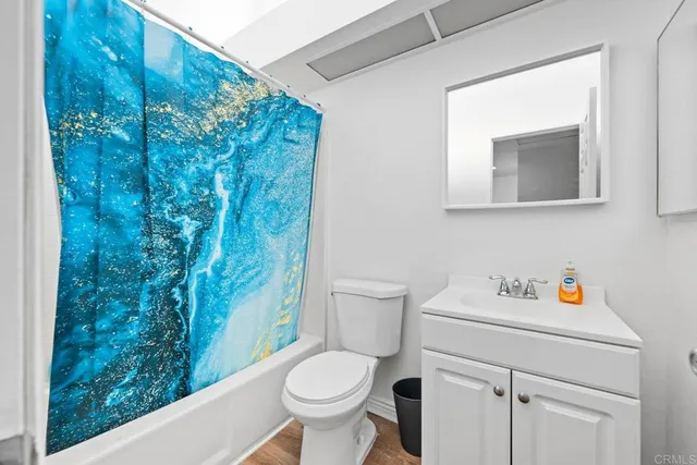 a bathroom with a toilet and a sink