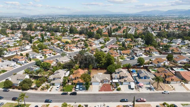 an aerial view of residential houses with outdoor space