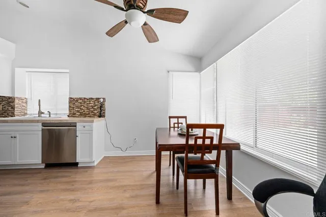 a kitchen with a table and chairs