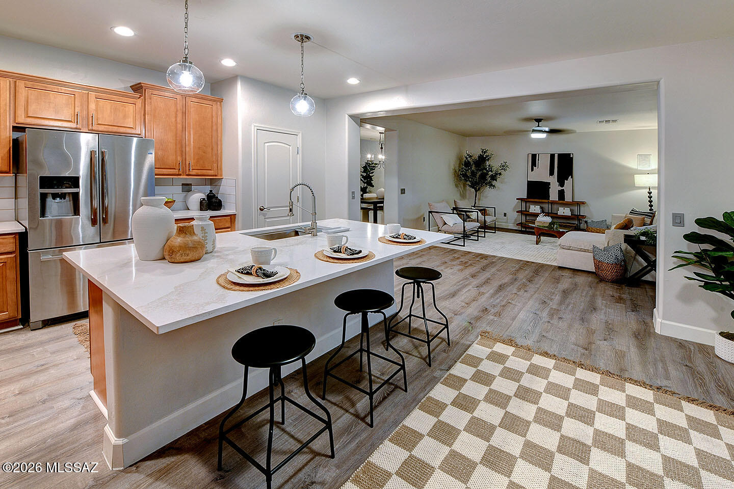 13464 North Piemonte Way Oro Valley, AZ 85755 - Photo 10 of 33 a view of a dining room kitchen and a wooden floor