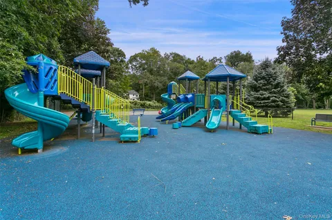 a view of a park with slide and a slide