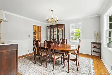 a view of a dining room with furniture and window
