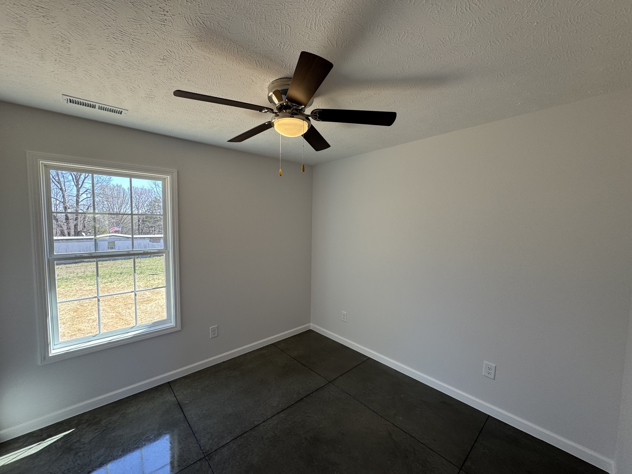 111 White Lane Portland, TN 37148 - Photo 4 of 9 a view of empty room with wooden floor and fan