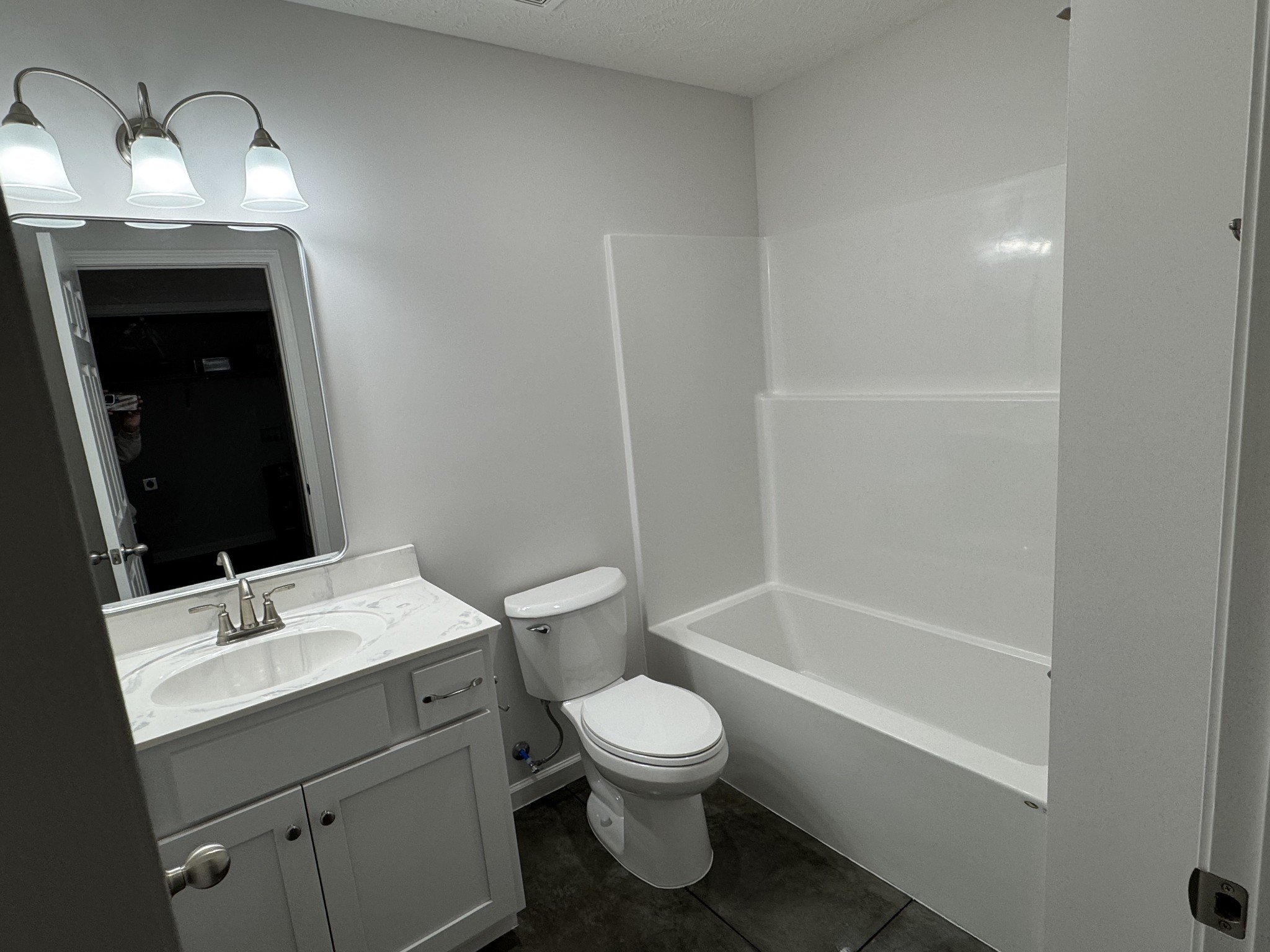 111 White Lane Portland, TN 37148 - Photo 7 of 9 a bathroom with a toilet a sink and a mirror