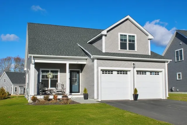 a front view of a house with a yard