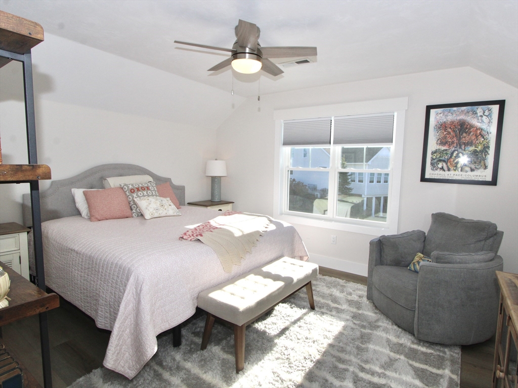 10 Salisbury Hill Boulevard, Unit 75 Worcester, MA 01609 - Photo 20 of 29 a bedroom with a bed couch and window