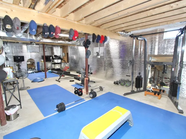a room with gym equipment and a large window
