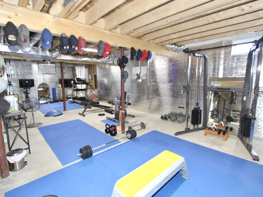 10 Salisbury Hill Boulevard, Unit 75 Worcester, MA 01609 - Photo 24 of 29 a room with gym equipment and a large window