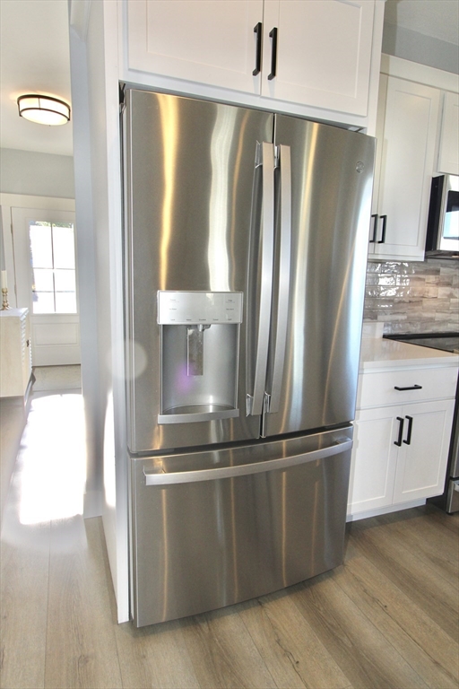 10 Salisbury Hill Boulevard, Unit 75 Worcester, MA 01609 - Photo 9 of 29 a kitchen with stainless steel appliances granite countertop a refrigerator and a stove