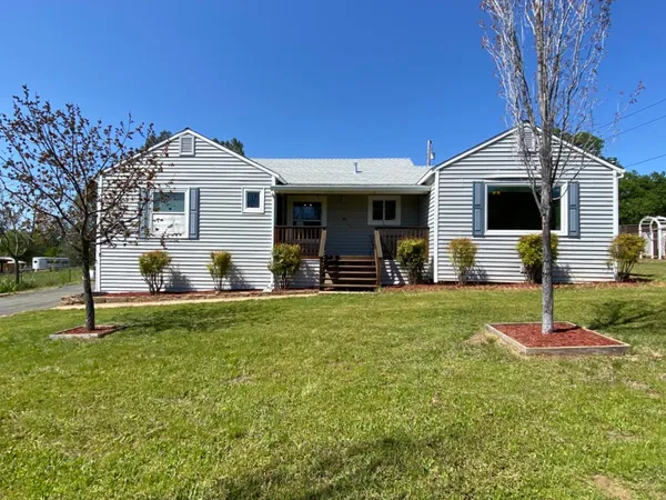 a front view of house with yard