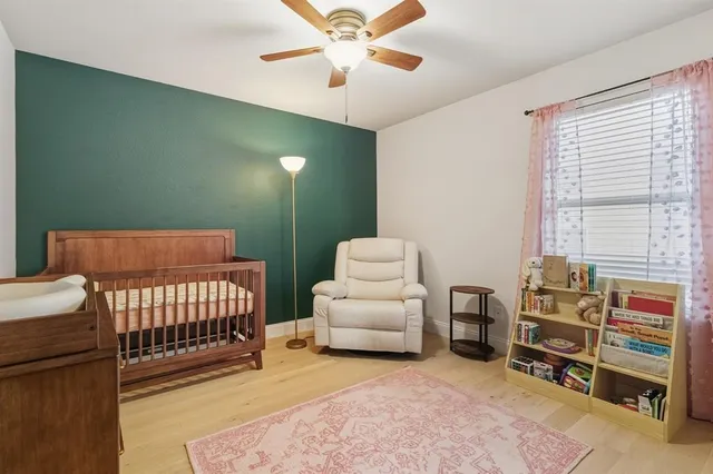 a bedroom with furniture and a window