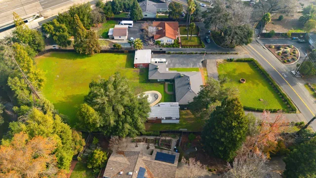 an aerial view of a house with swimming pool