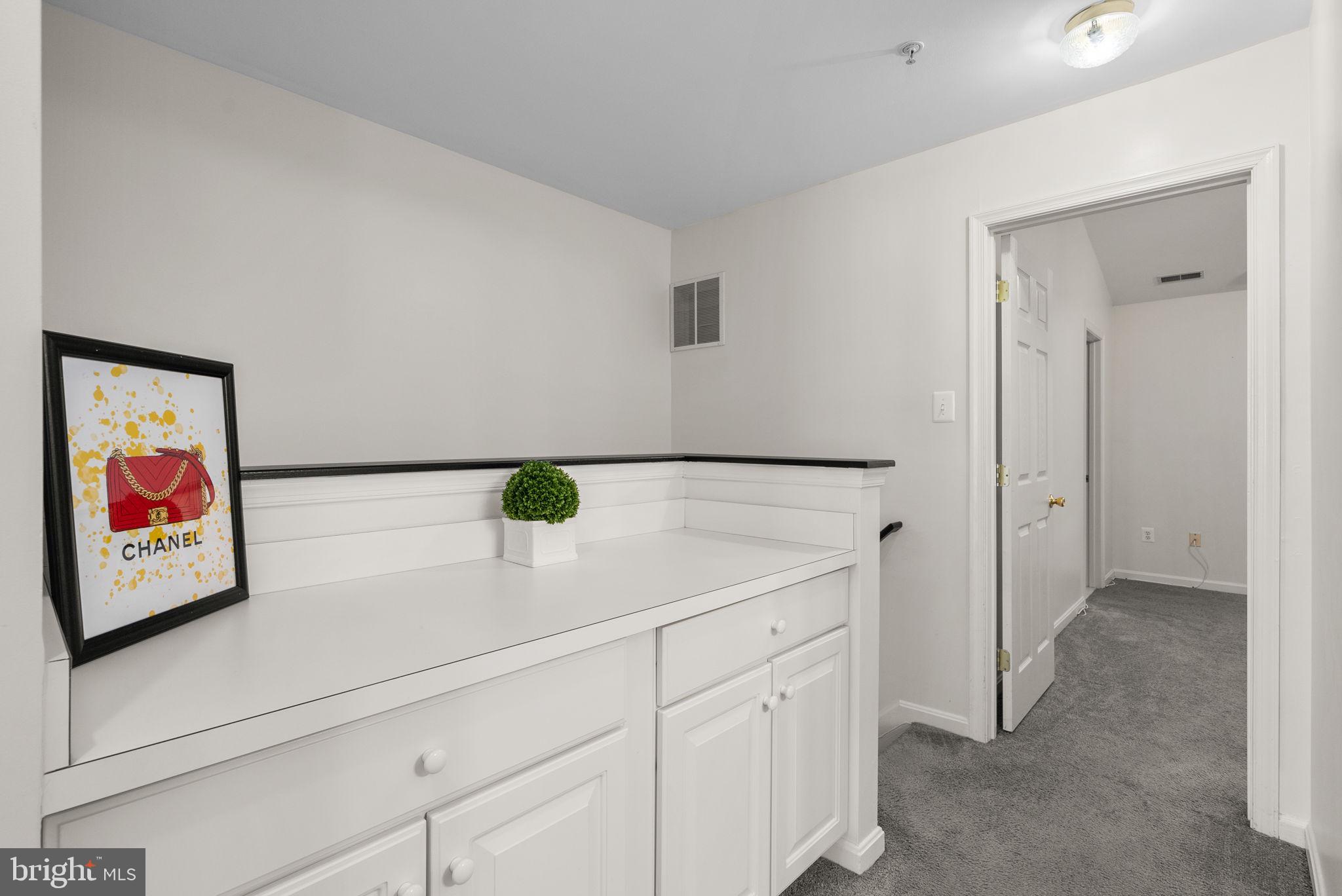 6710 Tranquil Way Elkridge, MD 21075 - Photo 23 of 49 a view of cabinets with wooden floor