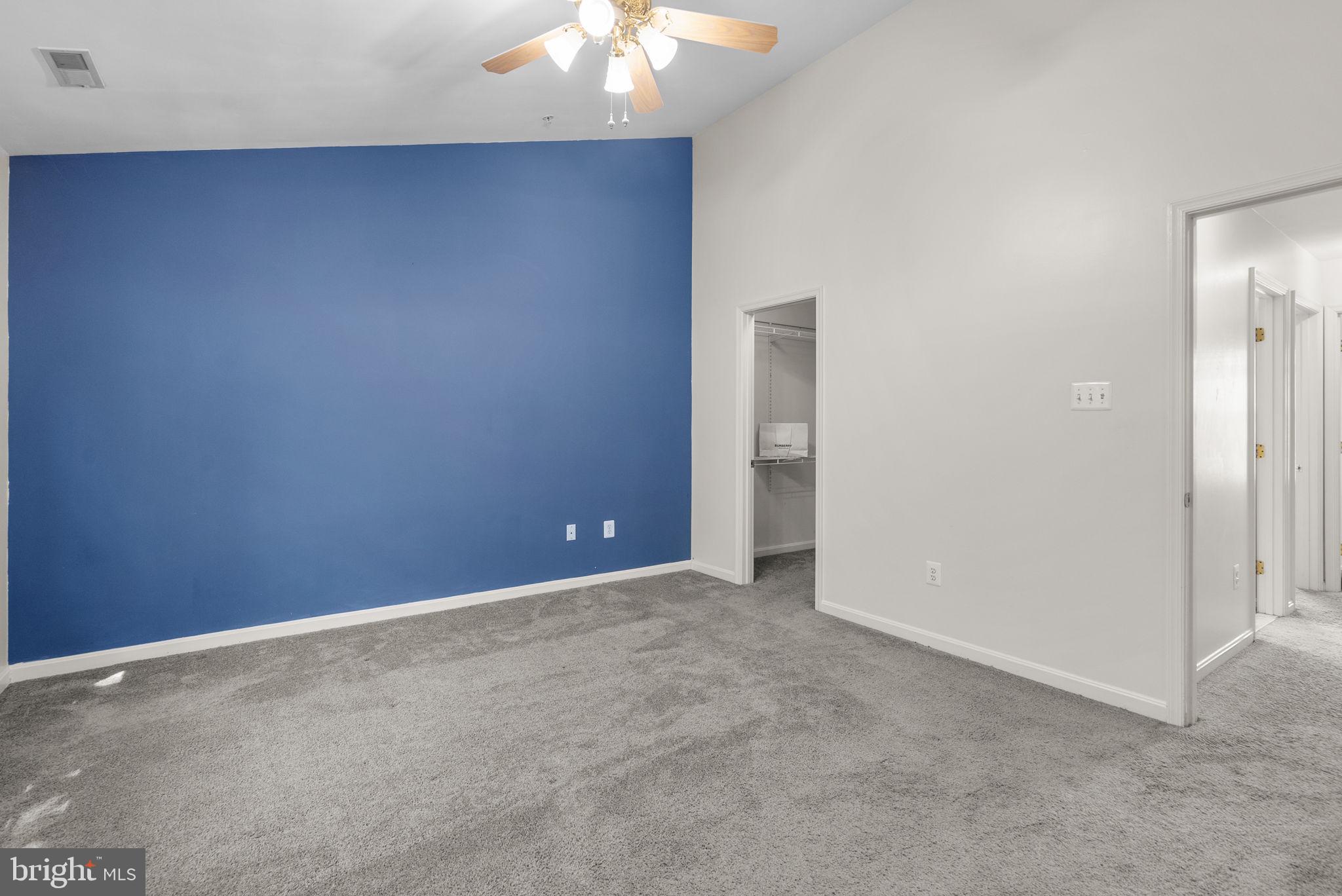 6710 Tranquil Way Elkridge, MD 21075 - Photo 24 of 49 an empty room with a chandelier fan