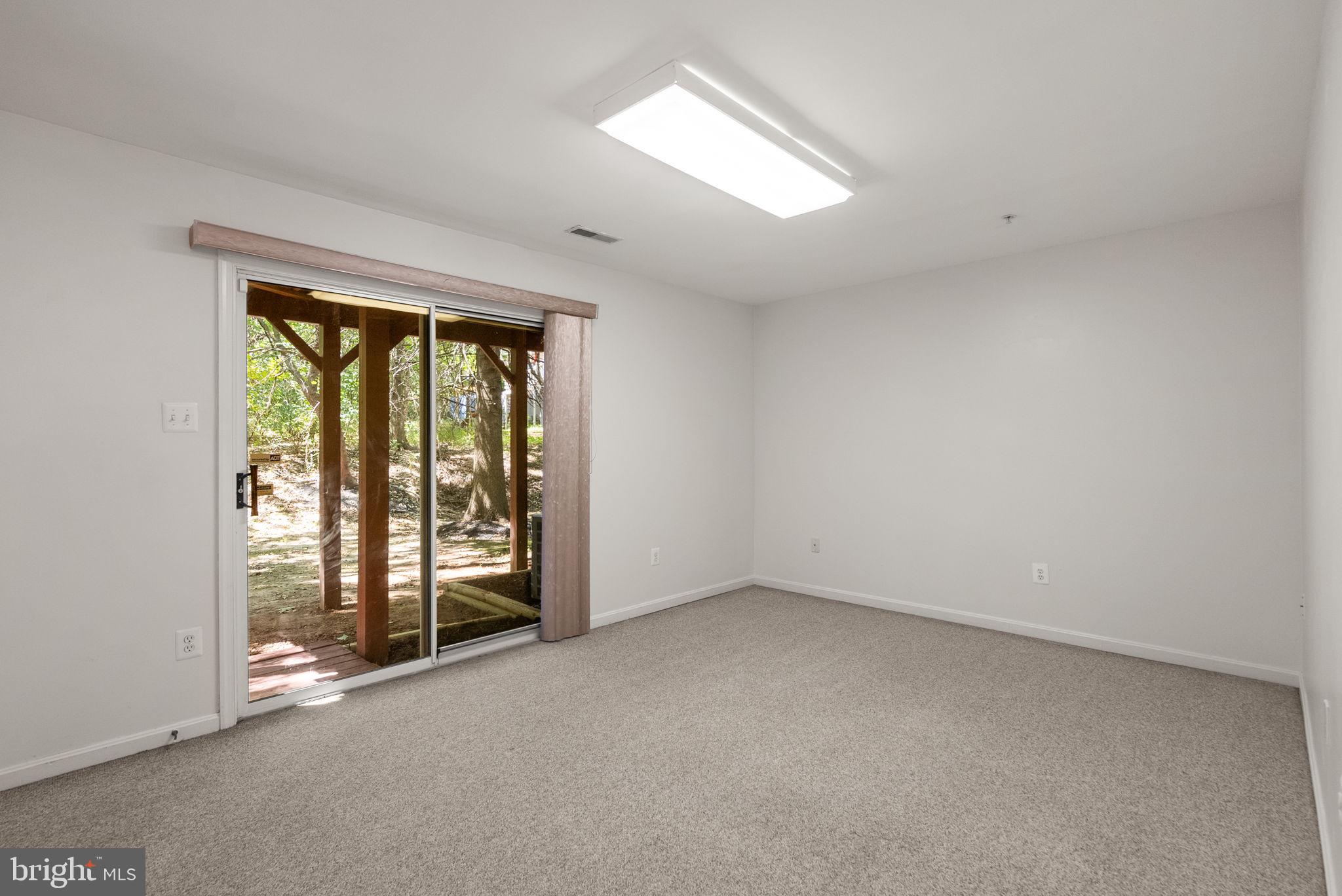 6710 Tranquil Way Elkridge, MD 21075 - Photo 37 of 49 an empty room with windows