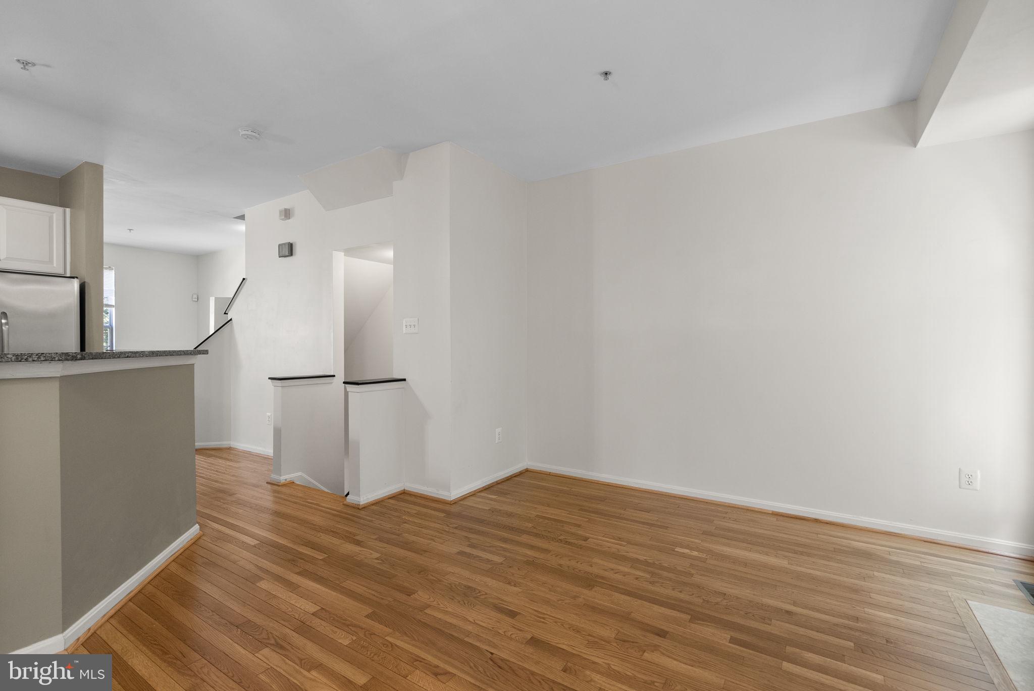 6710 Tranquil Way Elkridge, MD 21075 - Photo 4 of 49 a view of empty room with wooden floor