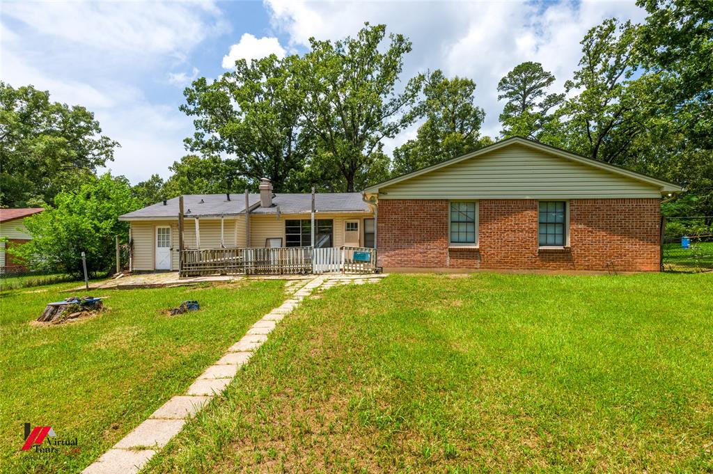 3109 Gorton Road Shreveport, LA 71119 - Photo 29 of 31 a front view of a house with a garden