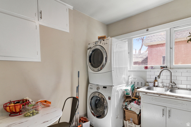 386 North 500 East Provo, UT 84606 - Photo 4 of 24 Laundry room featuring cabinet space and stacked washer / drying machine