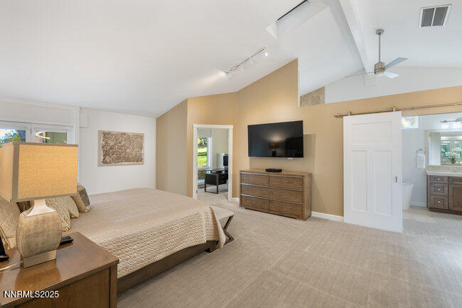 2522 Lake Ridge Shores Circle Reno, NV 89519 - Photo 22 of 50 a bedroom with a bed and a flat screen tv