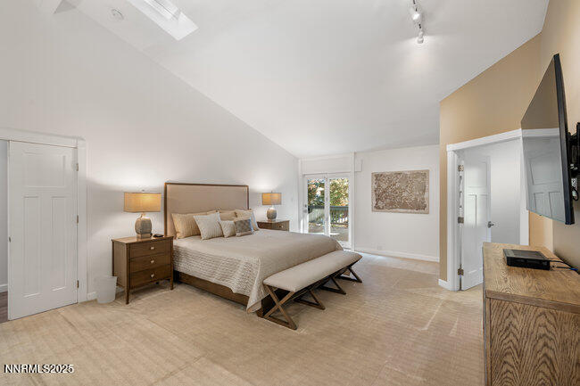 2522 Lake Ridge Shores Circle Reno, NV 89519 - Photo 23 of 50 a bedroom with a bed and large windows