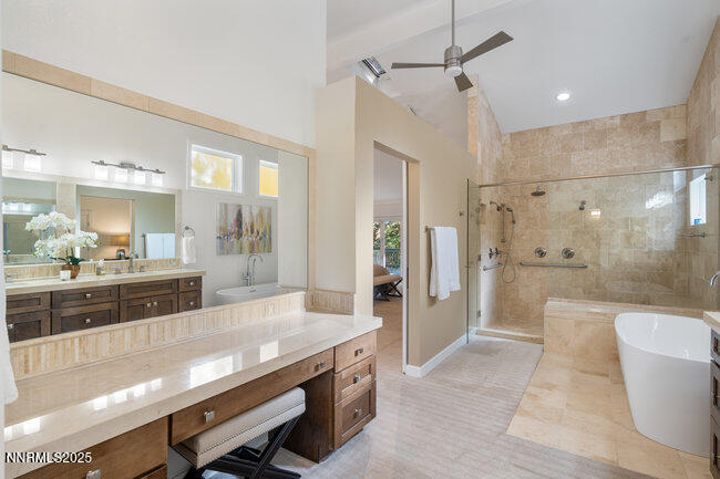 2522 Lake Ridge Shores Circle Reno, NV 89519 - Photo 27 of 50 a large bathroom with a large tub a shower a sink and view