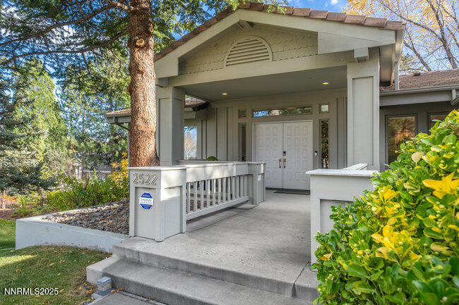 2522 Lake Ridge Shores Circle Reno, NV 89519 - Photo 3 of 50 a front view of a house with a garden