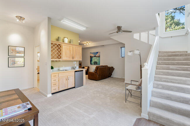 2522 Lake Ridge Shores Circle Reno, NV 89519 - Photo 33 of 50 a kitchen with a refrigerator and white cabinets