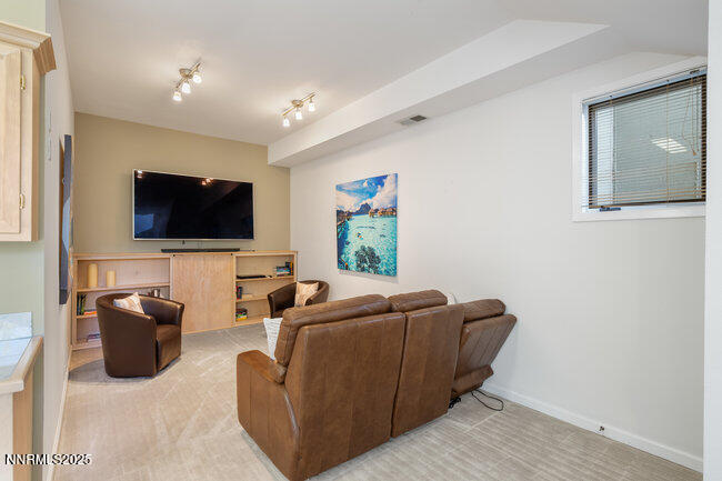 2522 Lake Ridge Shores Circle Reno, NV 89519 - Photo 34 of 50 a living room with furniture and a flat screen tv