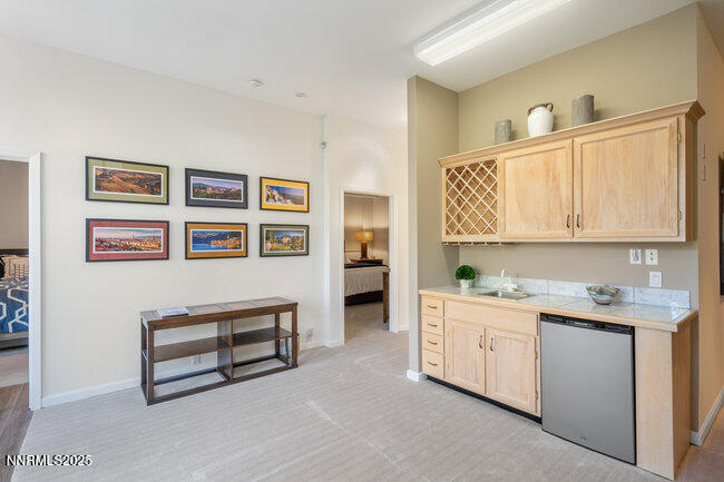 2522 Lake Ridge Shores Circle Reno, NV 89519 - Photo 35 of 50 a spacious bedroom with a bed and a cabinets