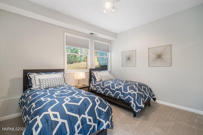 2522 Lake Ridge Shores Circle Reno, NV 89519 - Photo 36 of 50 a bedroom with two beds and a window