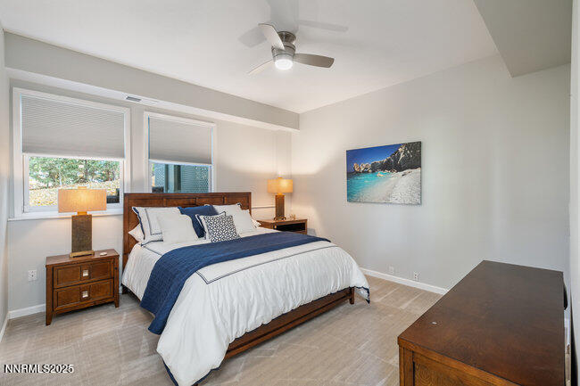 2522 Lake Ridge Shores Circle Reno, NV 89519 - Photo 37 of 50 a bedroom with a bed and a night stand