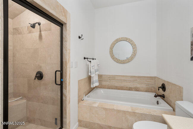 2522 Lake Ridge Shores Circle Reno, NV 89519 - Photo 39 of 50 a bathroom with a tub and shower