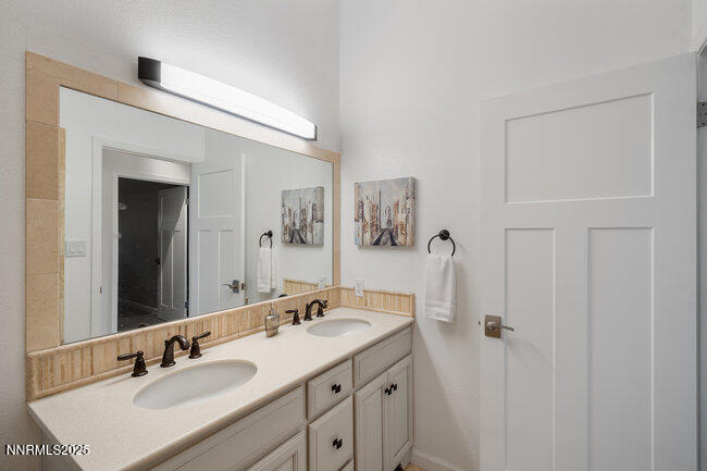 2522 Lake Ridge Shores Circle Reno, NV 89519 - Photo 40 of 50 a bathroom with a sink and a mirror