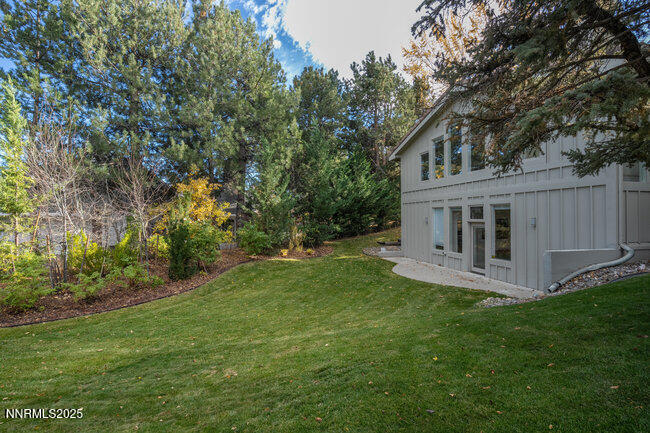 2522 Lake Ridge Shores Circle Reno, NV 89519 - Photo 42 of 50 a view of a house with a yard and a porch