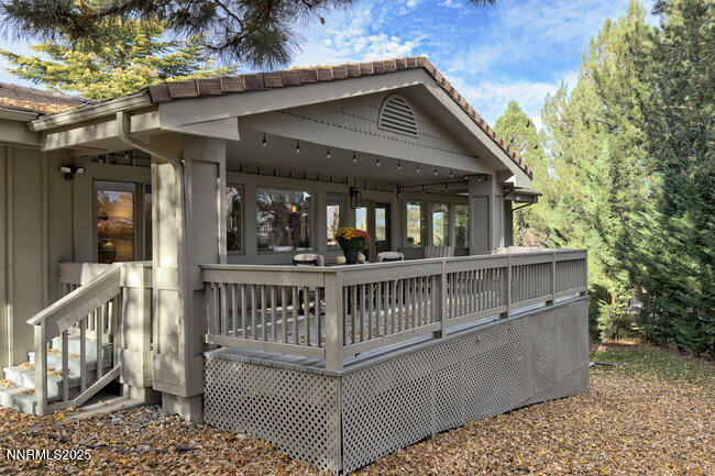 2522 Lake Ridge Shores Circle Reno, NV 89519 - Photo 44 of 50 a view of a house with large windows and wooden fence
