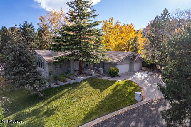 2522 Lake Ridge Shores Circle Reno, NV 89519 - Photo 48 of 50 a view of a house with a yard
