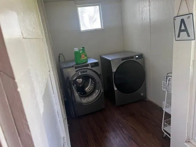 a bathroom with a toilet sink and shower