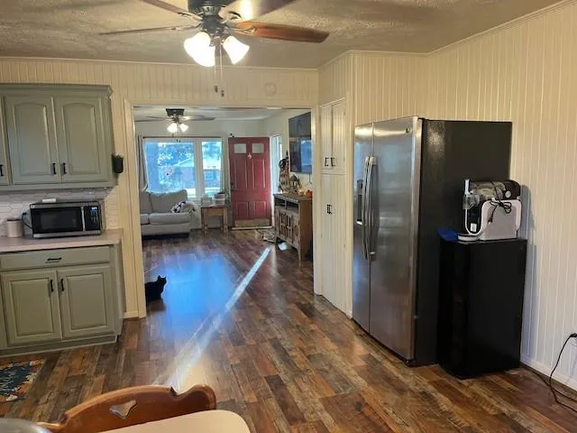a kitchen with a stove cabinets and window