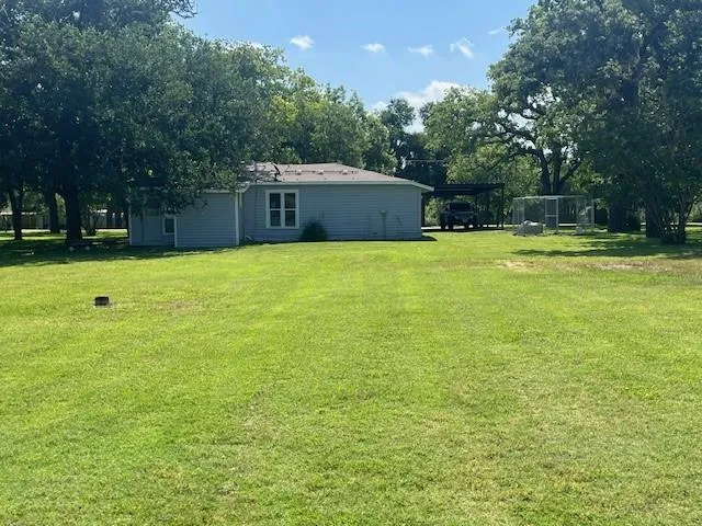 a swimming pool is sitting in the middle of a field